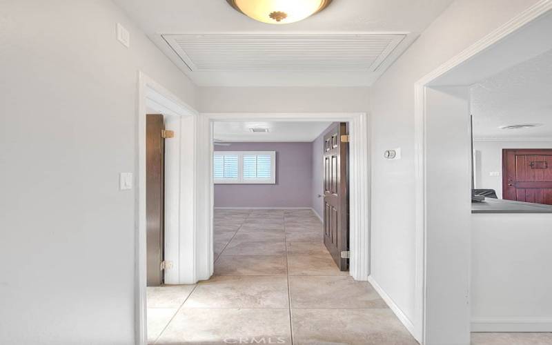 Hallway to 2 bedrooms and a bathroom