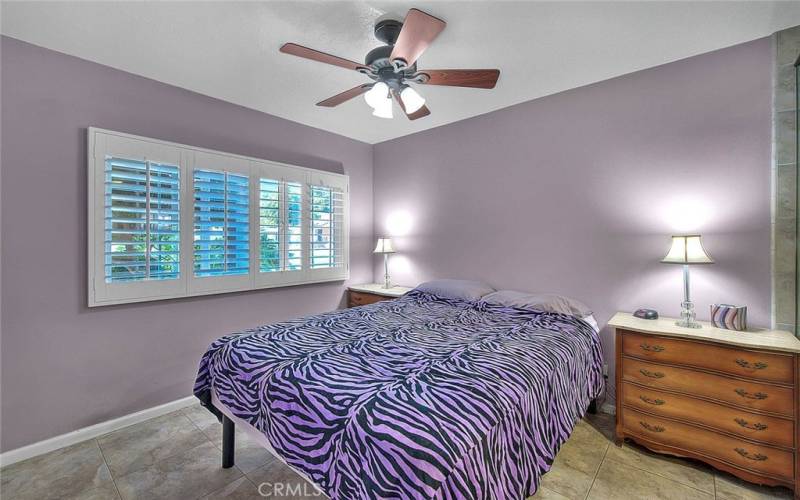 Primary bedroom with a celing fan