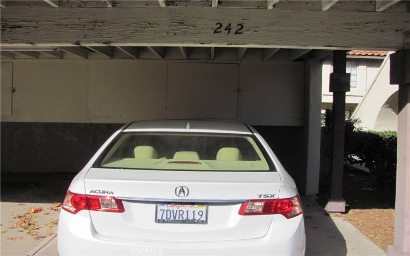 Your Carport #242, located in the back of the front entrance to home