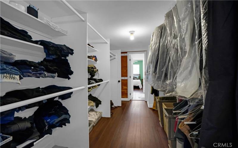 Spacious walk-in primary closet.