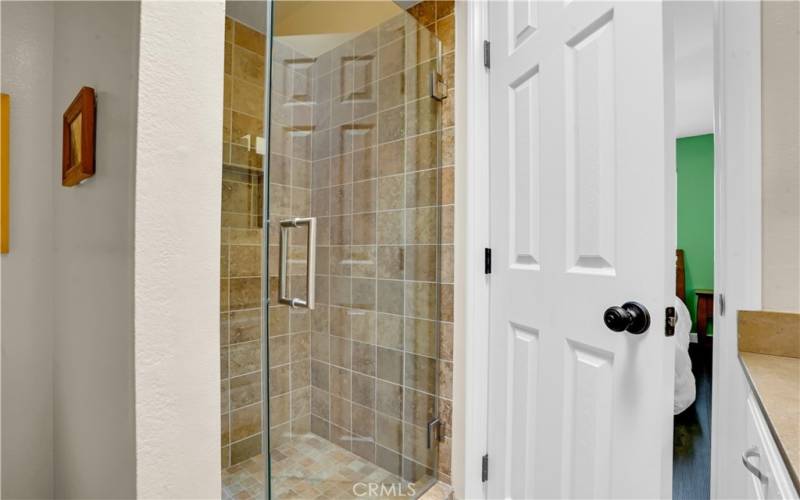 2nd bedroom ensuite bathroom with tiled shower.