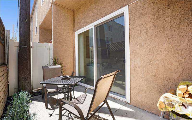 Private back patio with dual pane sliding glass door.