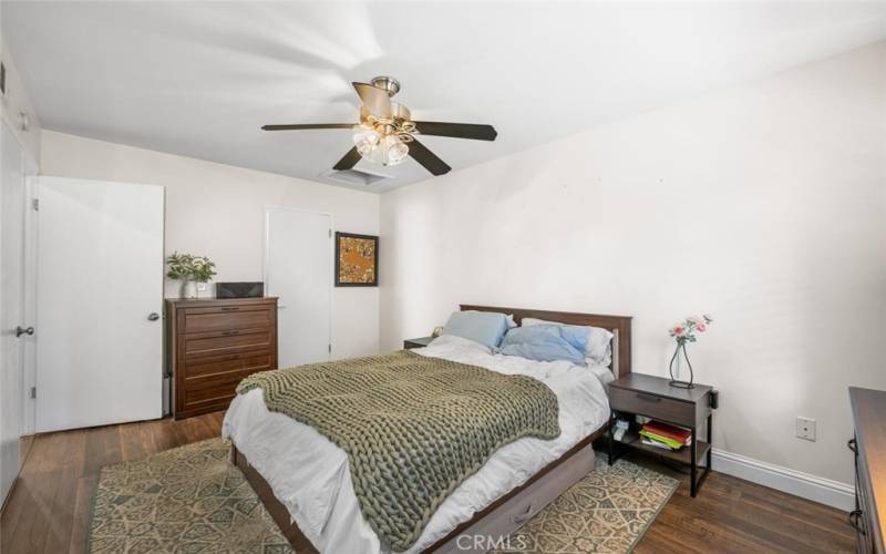 Walk in closet with built-ins as well as additional attic storage