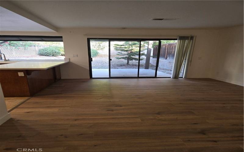 Family Room, looking at the Backyard with Kitchen on the left
