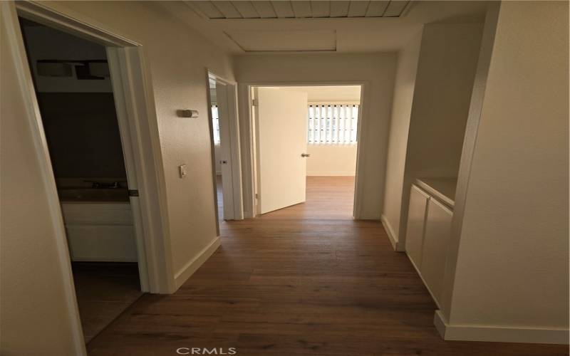 Upstairs Hallway, with Bedroom #3 directly ahead, 2nd Bath to the Left and Linen Cabinets and folding station to the Right