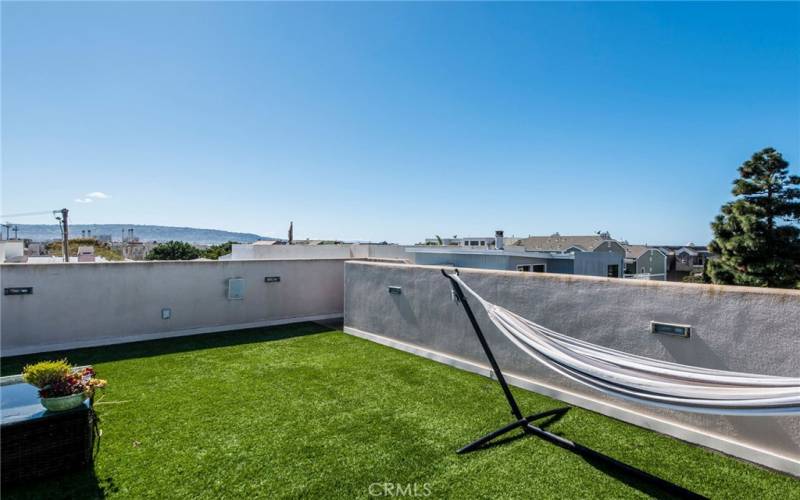 Rooftop deck has just been resurfaced.  Grass has been removed.