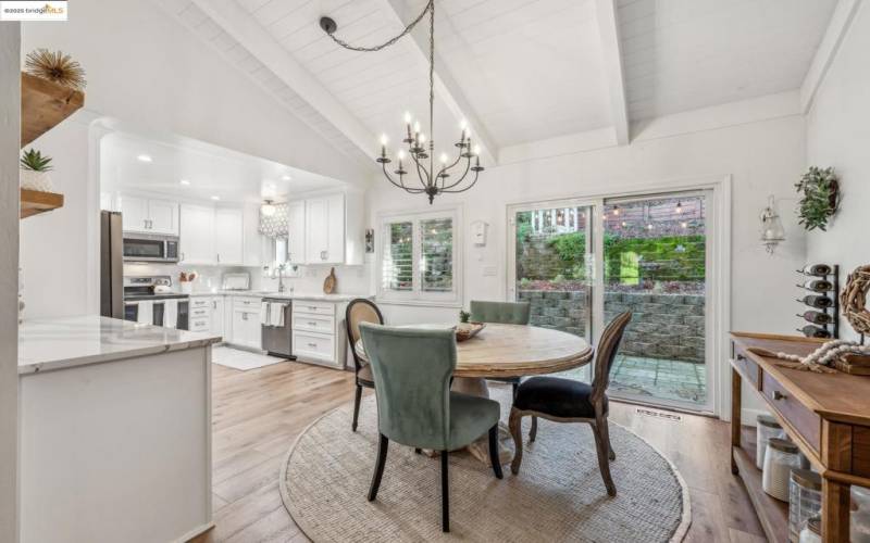 Bright dining area with chandelier.