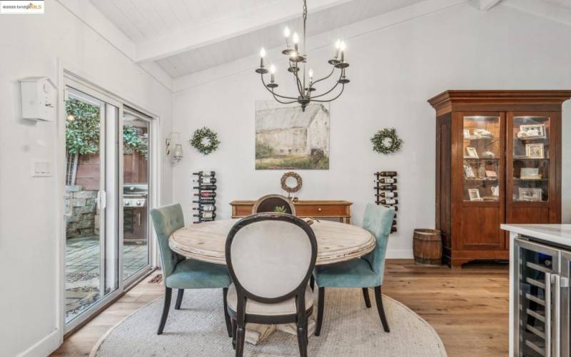 Bright dining area with chandelier.