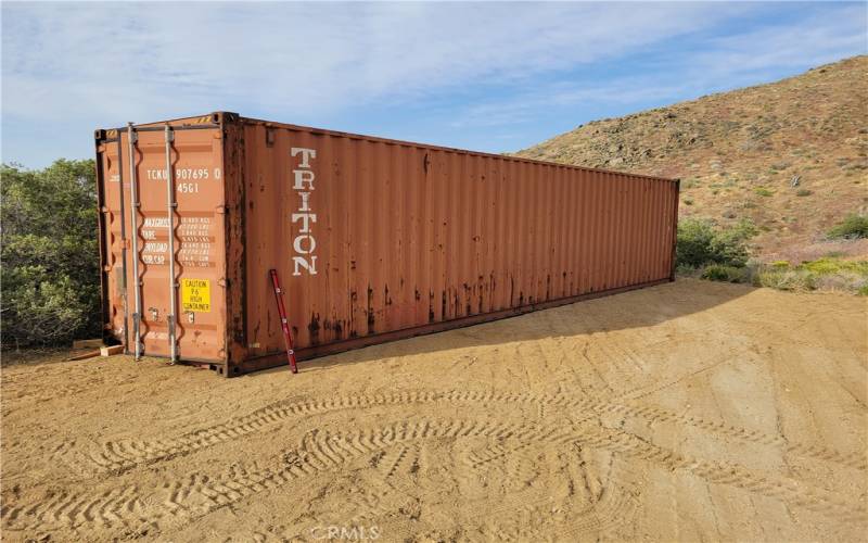 40FT shipping container @ gravel parking pad