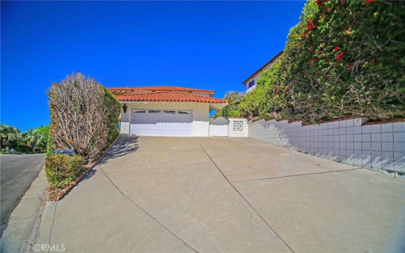 Large Driveway to the Attached Two Car Garage.