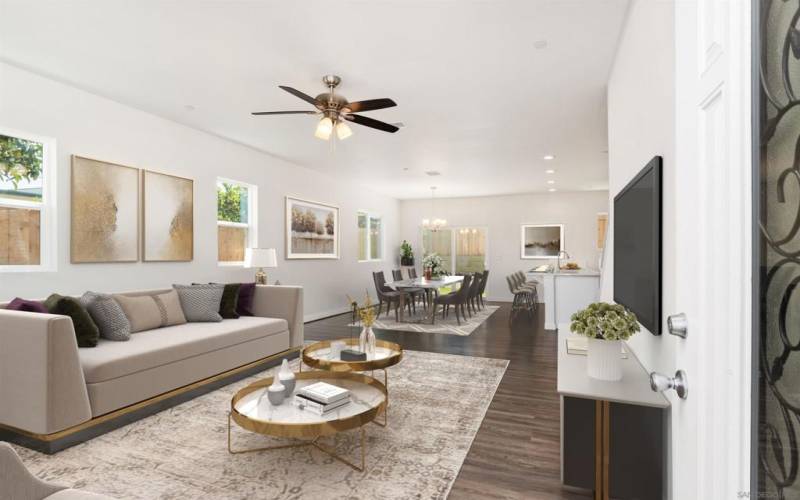 Entry into the home.  Virtually Staged Living Room that leads to a large adjoining dining room next to the kitchen