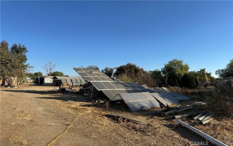 The solar panels on the property. These panels were installed by the seller. One of the original off grid homes created by an off grid pioneer.