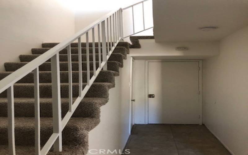 stairs showing direct access to garage