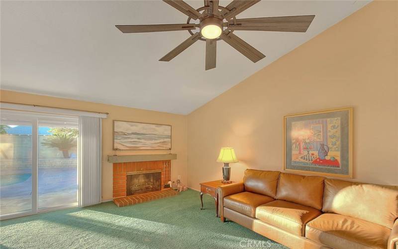 Formal Living Room With a Brick Fireplace