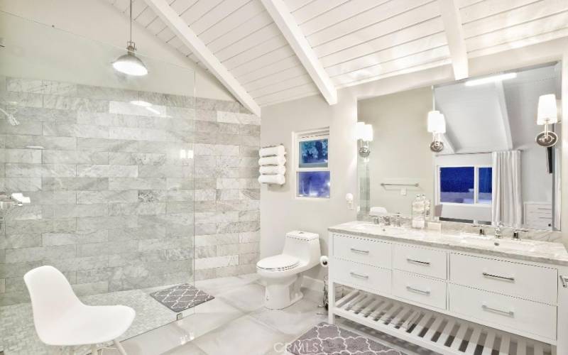 Light and Bright Master Bathroom with dual sinks, Carrera Marble counter and exquisite Master shower.