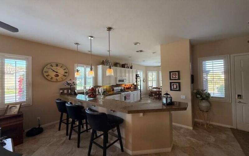 Kitchen window to door with chairs