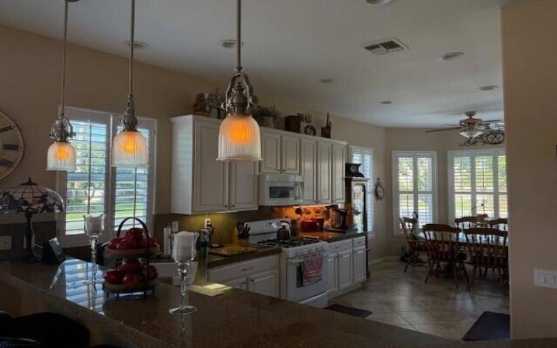 Kitchen with cabinets and wall on rt