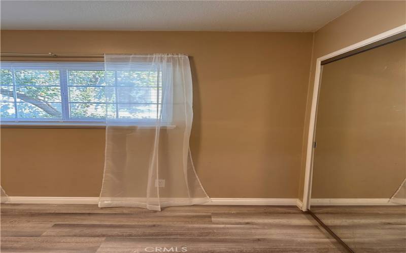 2nd bedroom mirrored closet with light inside.