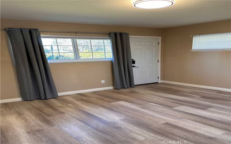 Master bedroom with door going to backyard.