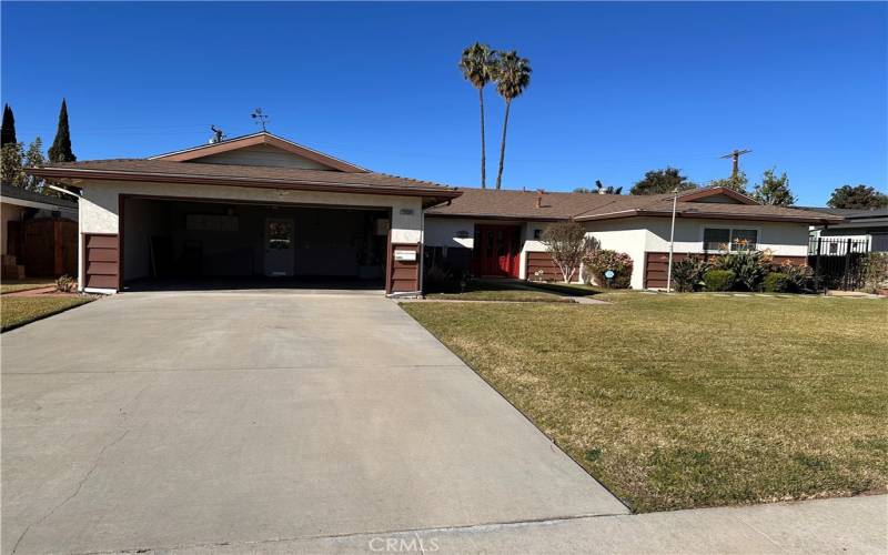 Frontage with garage open.