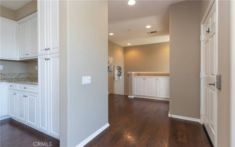 Elevator to the right, plus spacious stair landing near kitchen.