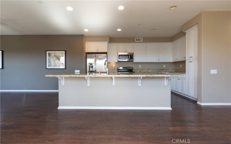 Island and breakfast bar in kitchen.