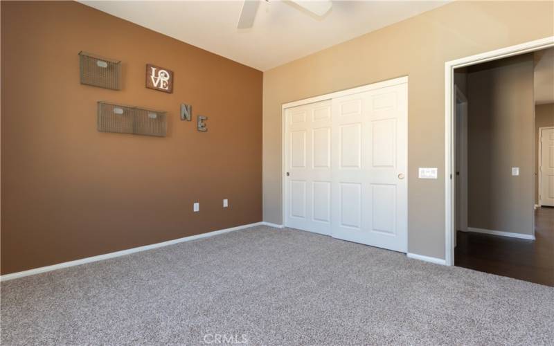 Generous closet and accent wall.