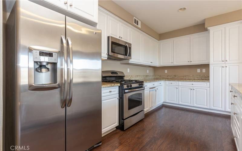 Loads of cabinets plus a pantry cupboard in the kitchen.