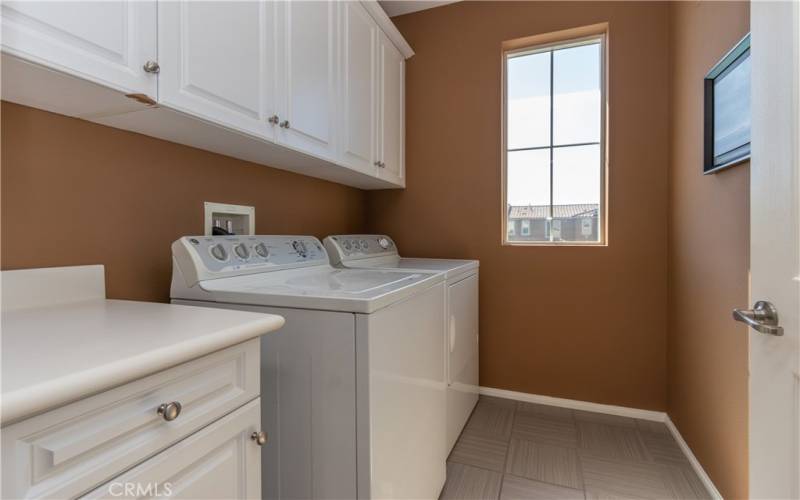 Laundry room with cupboards.