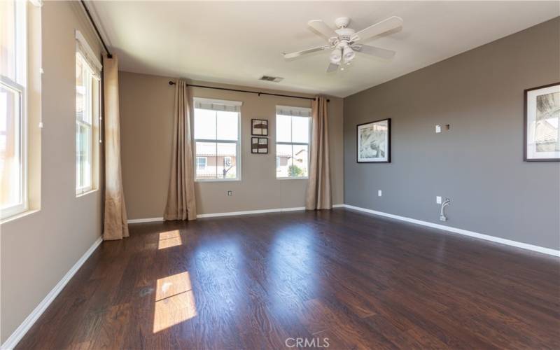 Ceiling fan and wiring for tv on wall in family room.