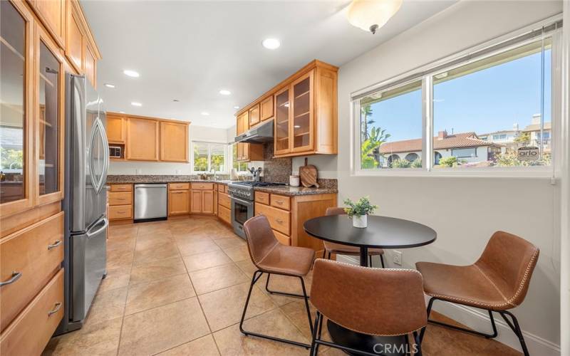 Kitchen has plenty of space for a bistro or pub table making this eating area casual and cozy. The appliances include a refrigerator, dishwasher, oven, and 6 burner gas stove.