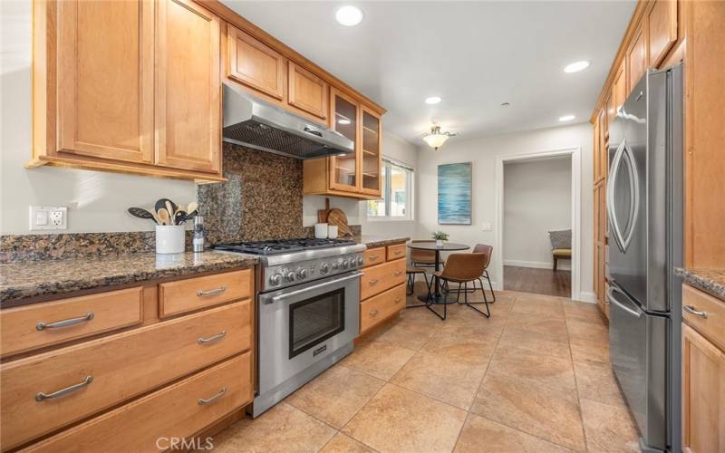 Boasting granite countertops, custom-built oak cabinetry, and professional-grade stainless steel appliances!