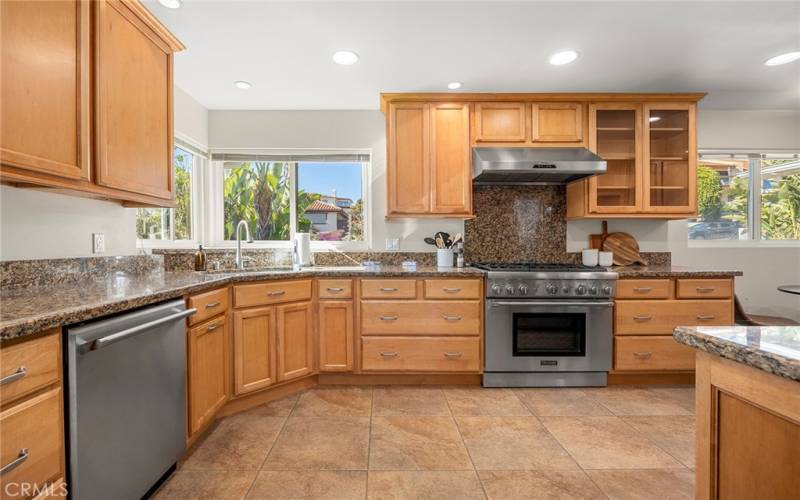 Kitchen is adjacent to dining room and window over kitchen sink allows you to see your guests as they arrive.