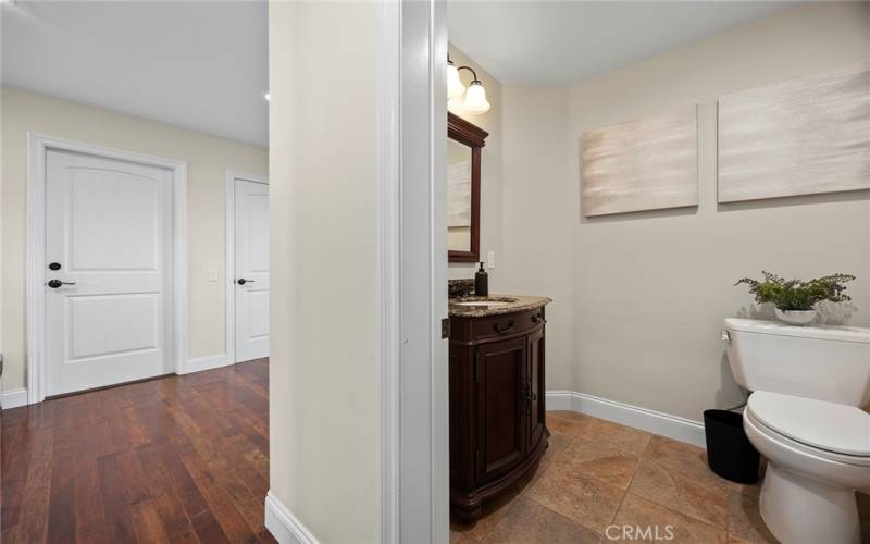 A well-appointed powder room off the living room add flexibility and convenience for guests.