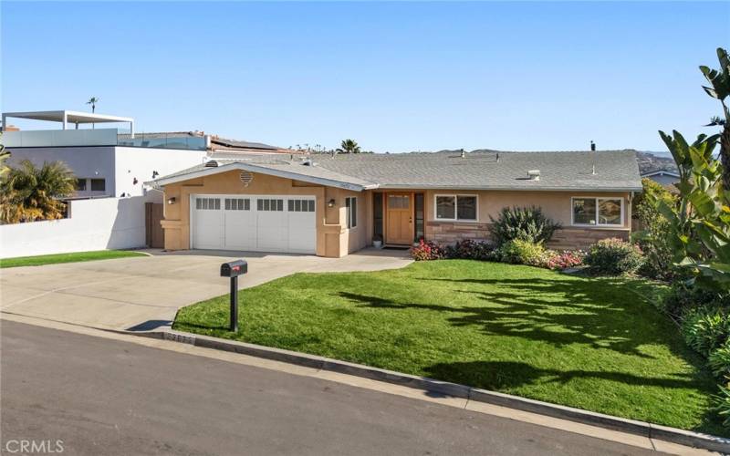 This home includes a two-car garage with direct access to the house, epoxy flooring, and ample storage options.