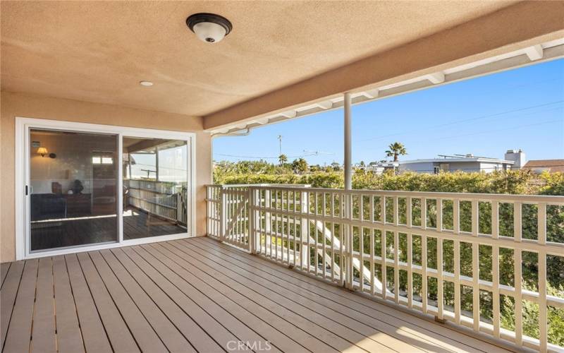 Whether you are in the primary suite or living room, step onto this covered balcony and smell the fresh ocean air!