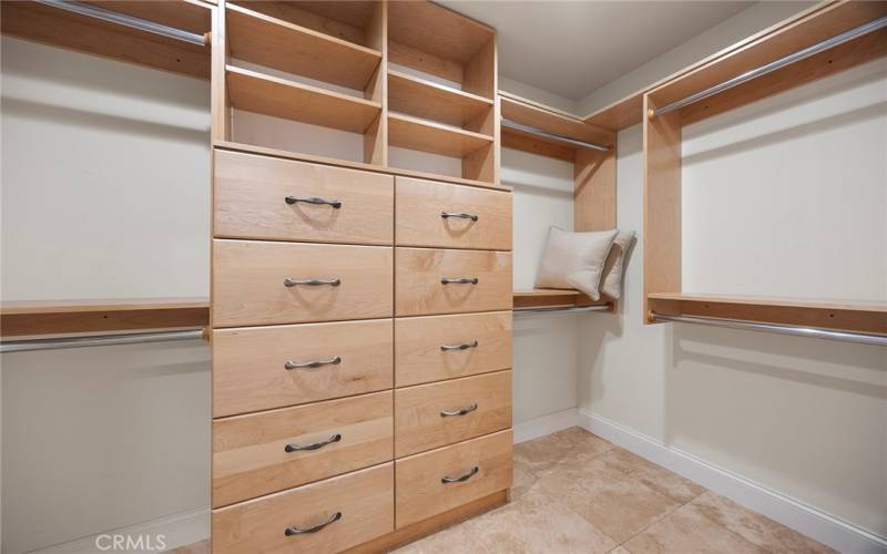 Customized built in closet organizers and cabinets make it easy to keep everything in order.