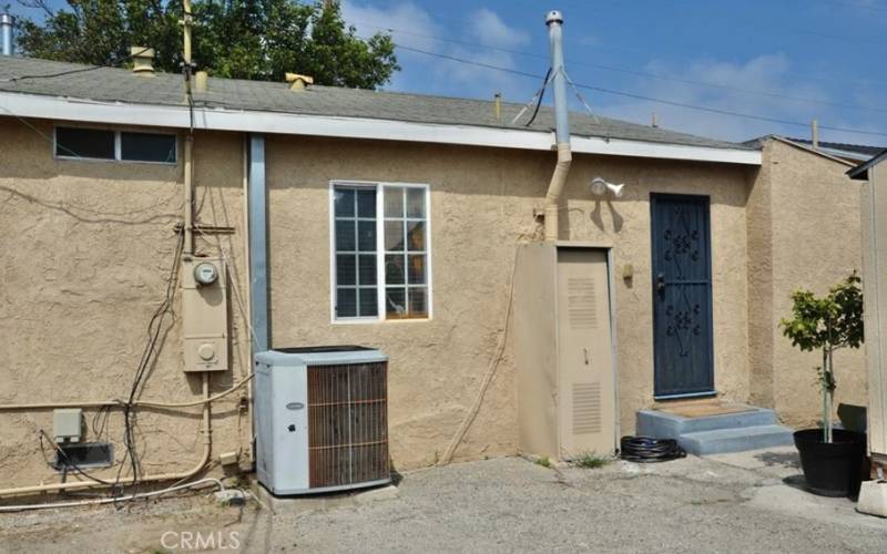 Back of main house with A/C unit