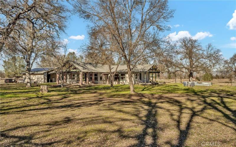 Back of house from Oak tree grove