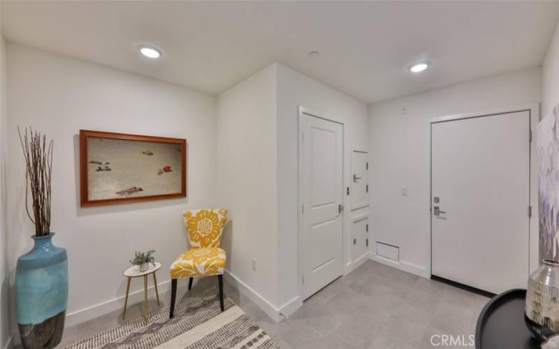 Welcome home. Entry foyer at front door / garage entrance / dumb waiter / renters closet.