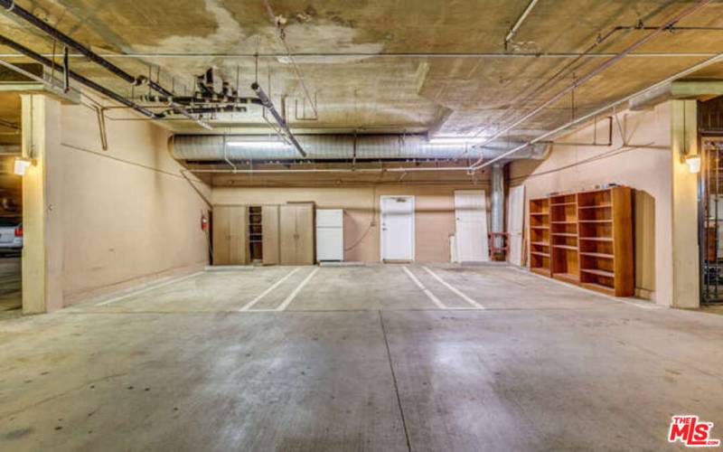 is unit has  garage spaces and additional space for storage or an extra refrigerator too!