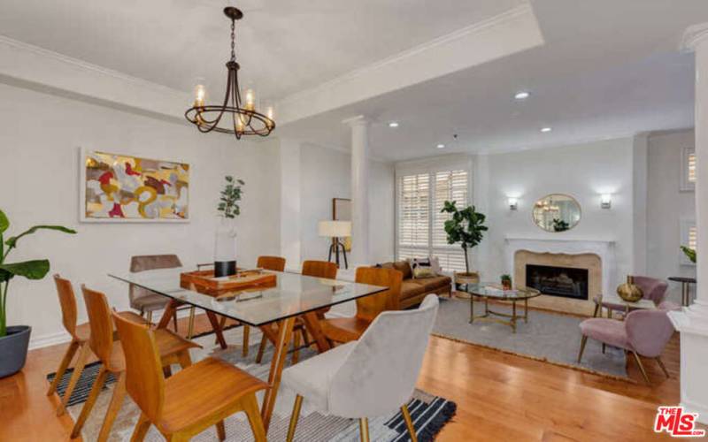 Spacious dining room offers updated chandelier and looks out to e living area.