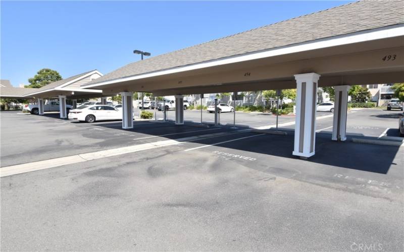 One car carport included plus plenty of guest parking. Note the free electric car power stations