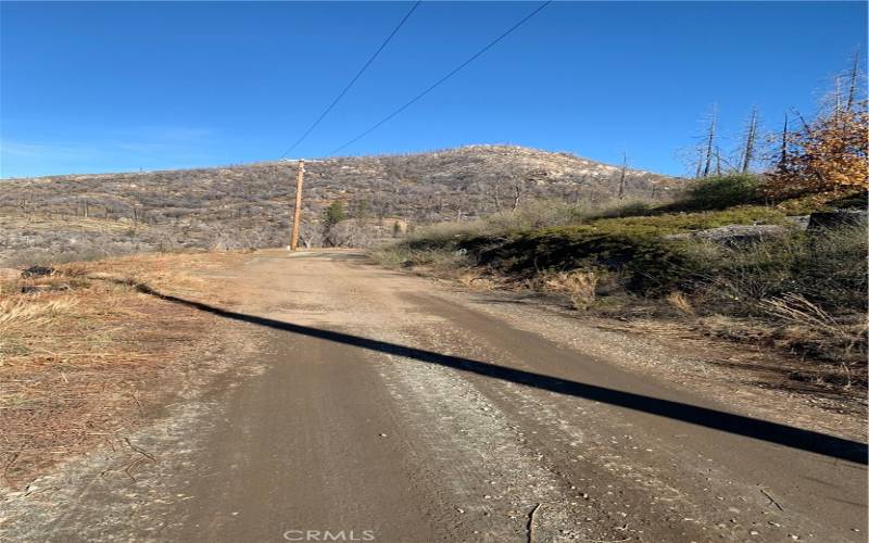 Road runs in front of property. Property on left.