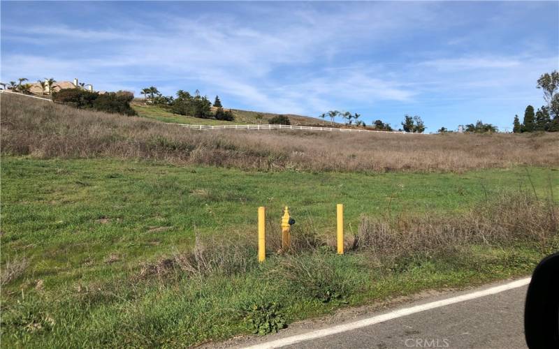 Hydrant near midpoint in 881-foot Calle Capistrano Frontage