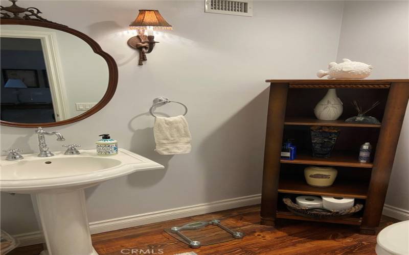 Powder room for guests of of kitchen.