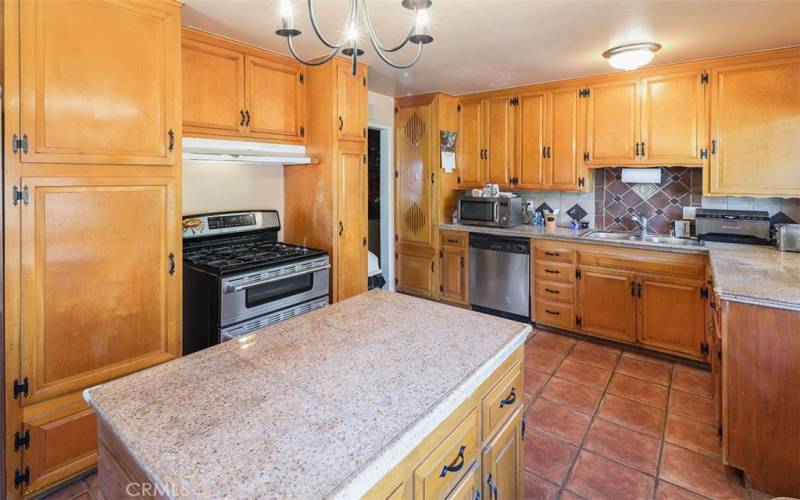 Beautiful true wood pine cabinets with upgrade tile flooring and granite counter tops!